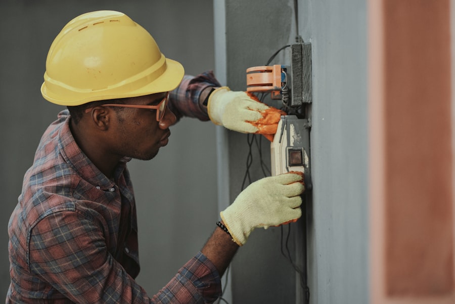 Electrician wiring an electrical panel on site