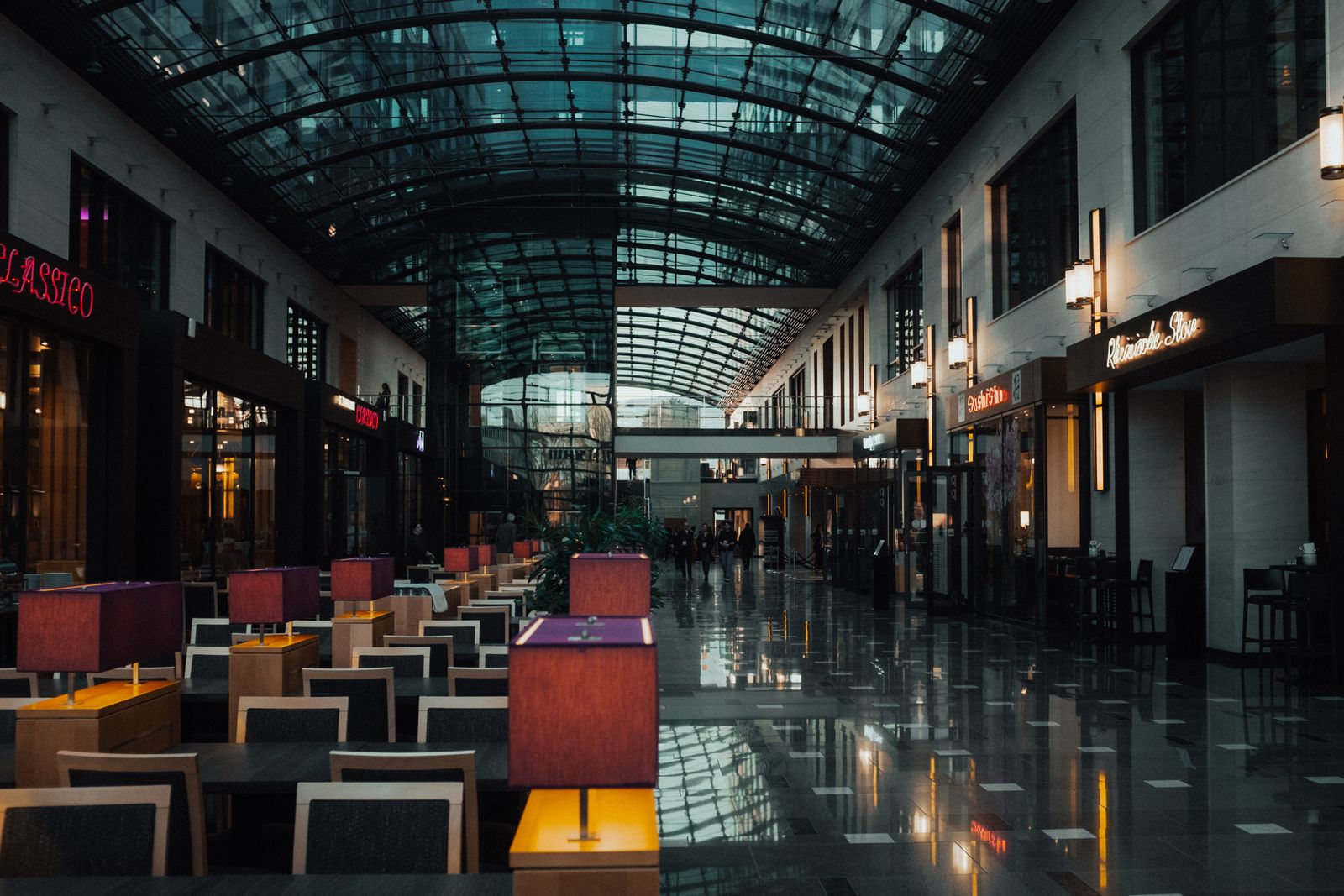 Elegant modern shopping mall interior with a glass ceiling