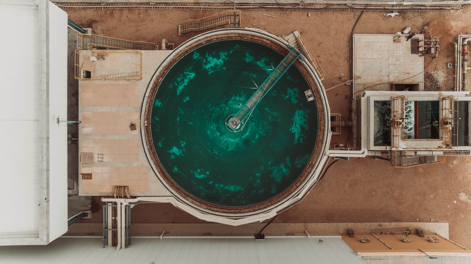 Aerial view of a circular water treatment tank at an industrial desalination facility